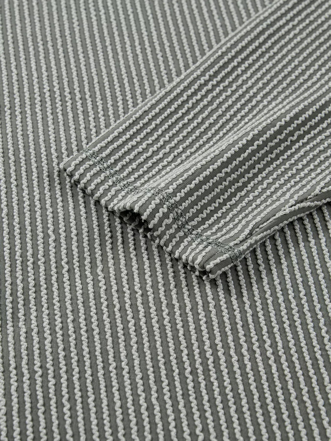 Sarah Express Women's Twist Ribbed Exposed Seam Detail Long Sleeve Loose Top