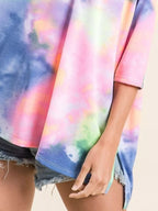 Sarah Express women’s oversized low gauge knit top with a colorful tie-dye print.
