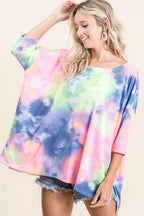 Sarah Express women’s oversized low gauge knit top with a colorful tie-dye print.
