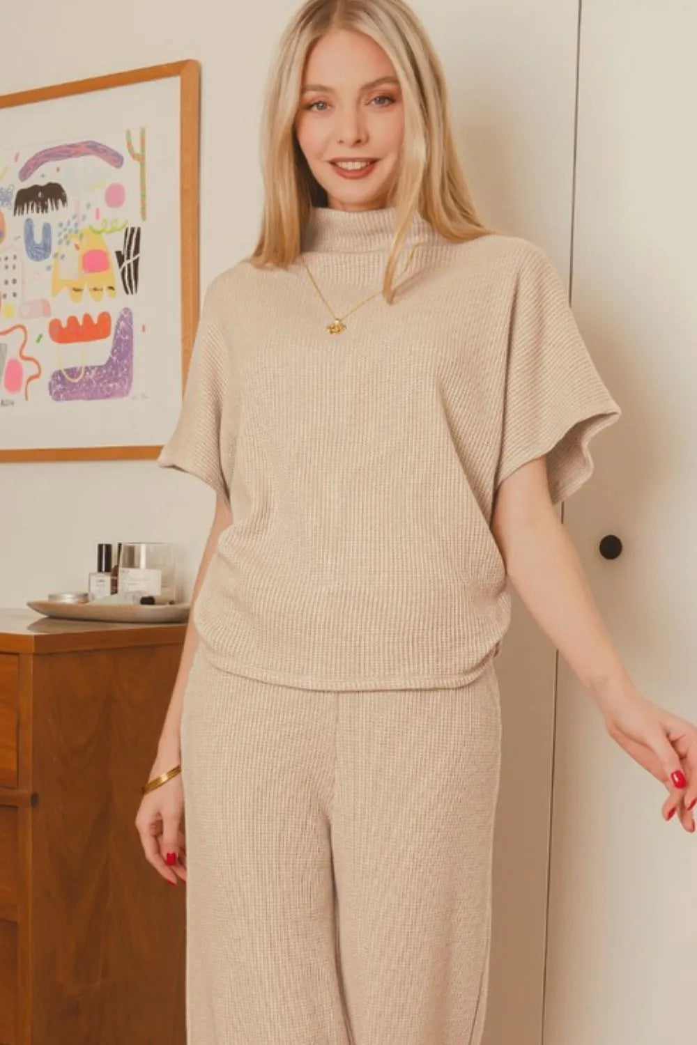 Sarah Express women’s beige ribbed sweater set featuring a turtleneck top and matching wide-leg pants.
