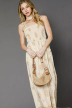 Sarah Express women’s floral print smocked jumpsuit with a wide-leg, cropped silhouette and pockets.
