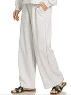 Sarah Express women’s oversized scuba lounge set featuring a crewneck sweatshirt and matching pocketed pants.