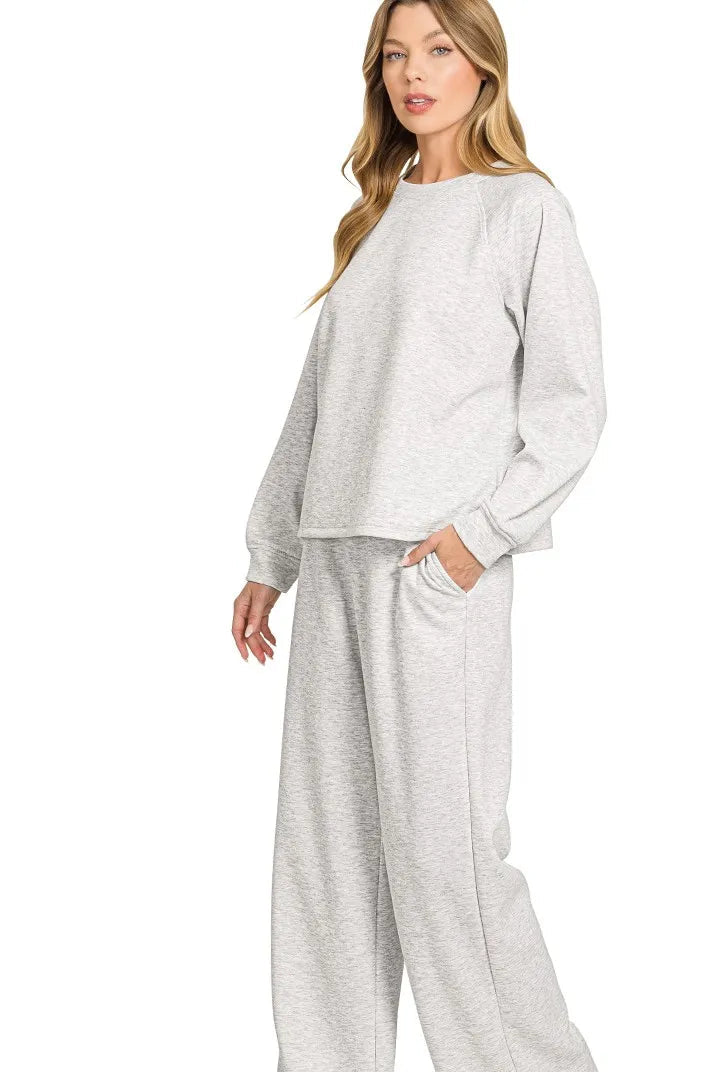 Sarah Express women’s oversized scuba lounge set featuring a crewneck sweatshirt and matching pocketed pants.