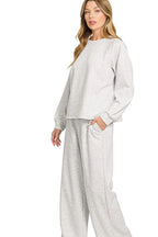 Sarah Express women’s oversized scuba lounge set featuring a crewneck sweatshirt and matching pocketed pants.