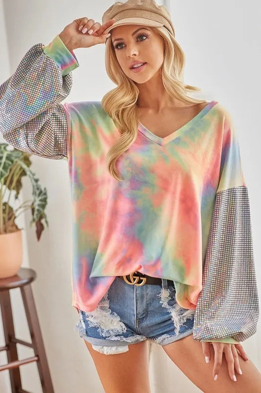 Sarah Express women’s oversized tie-dye French terry top with a V-neck and shimmer details.

